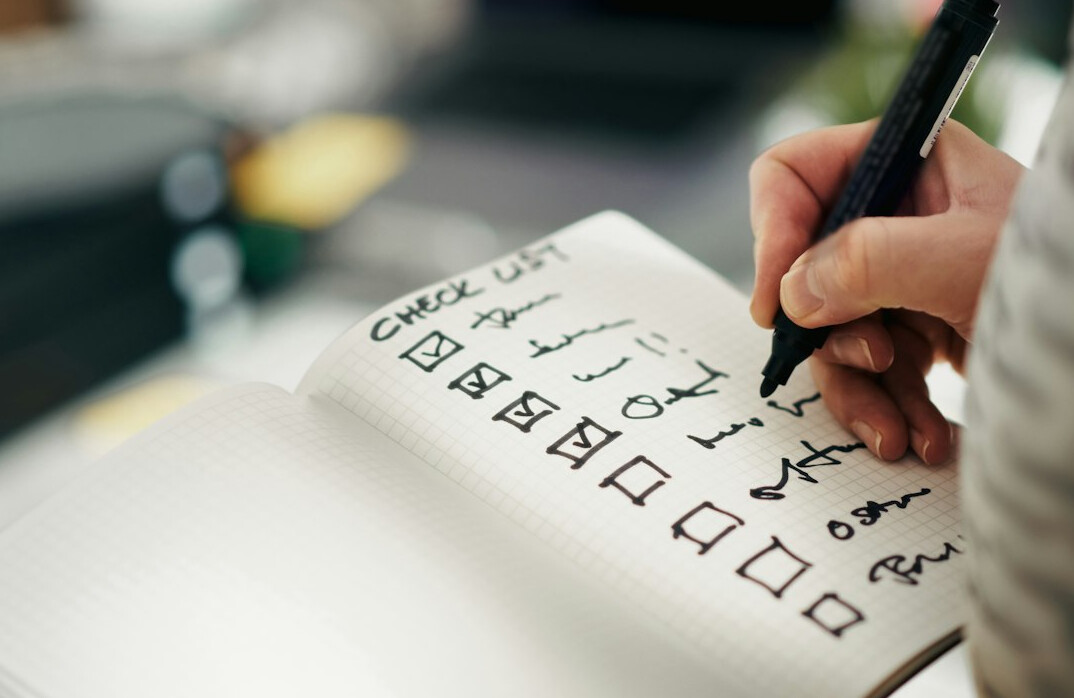 person writing gratitude list